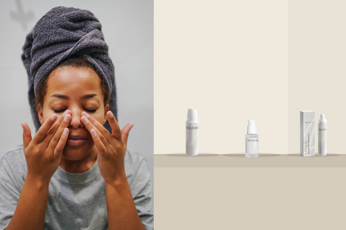 A woman with a towel wrapped around her hair, eyes closed, hands resting at her cheeks, beside VOLÉDESA LABS LUMINA, AQUAIRE and VITALIS on a stone counter